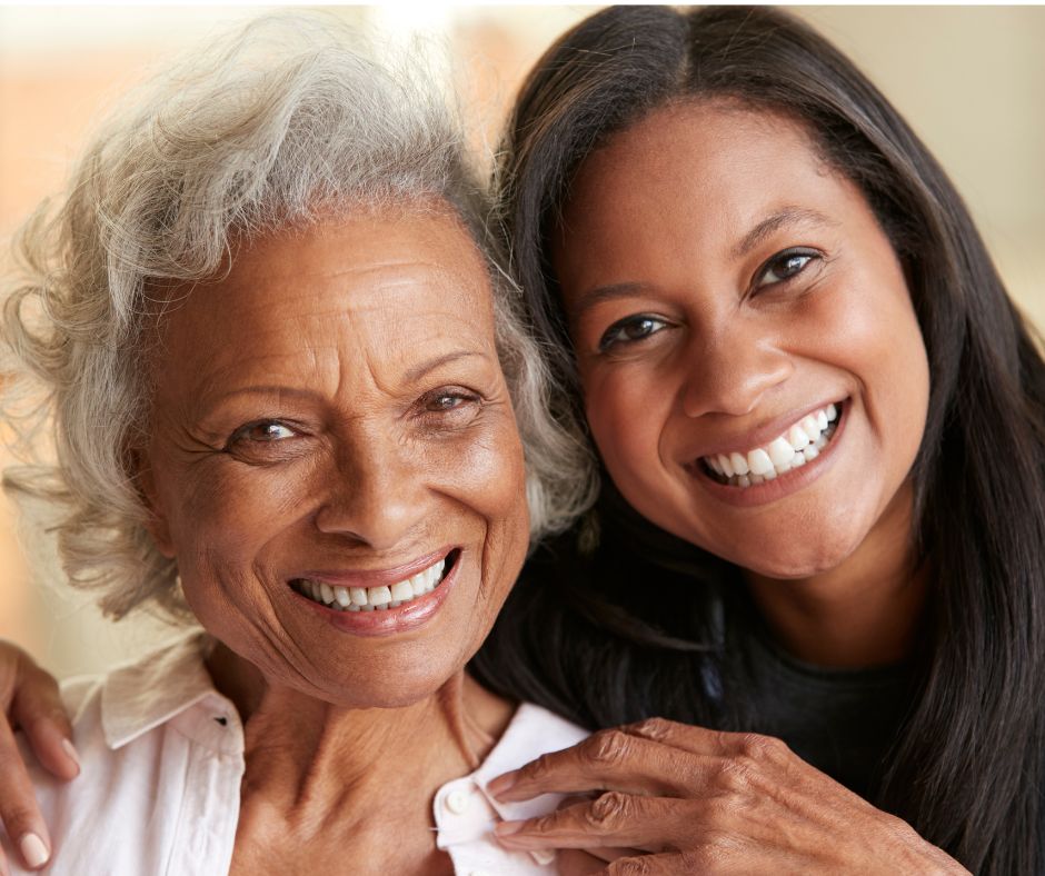 senior and caregiver smiling